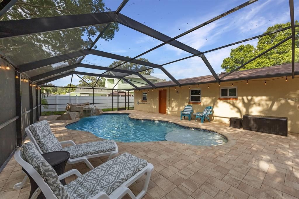 Pool area from corner looking toward the back wall of the house.