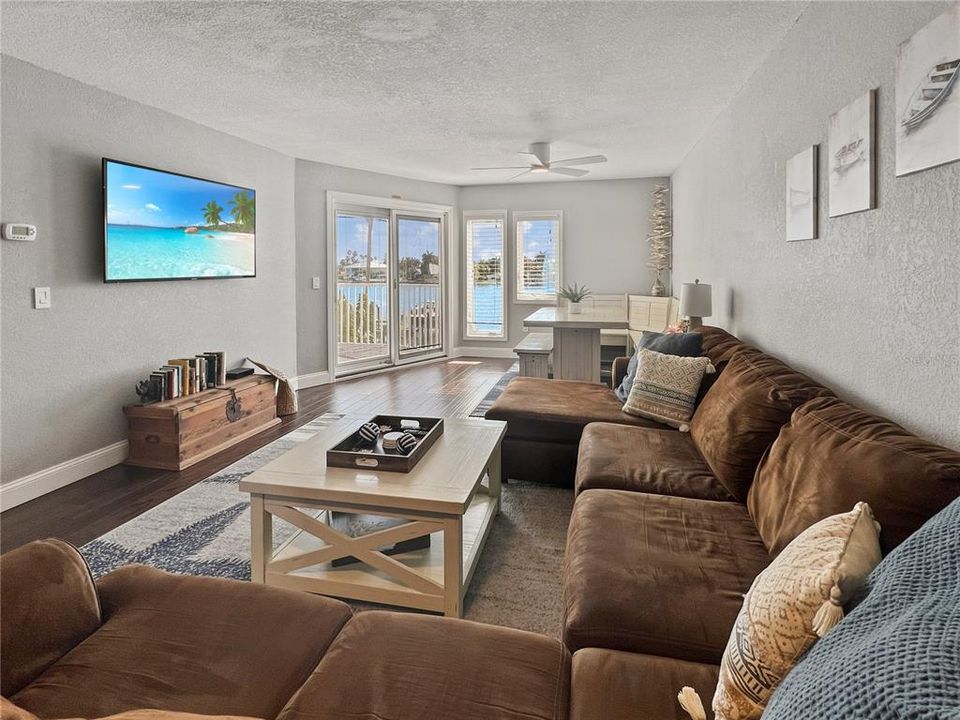 Living room with views of the intracoastal waterway and balcony access