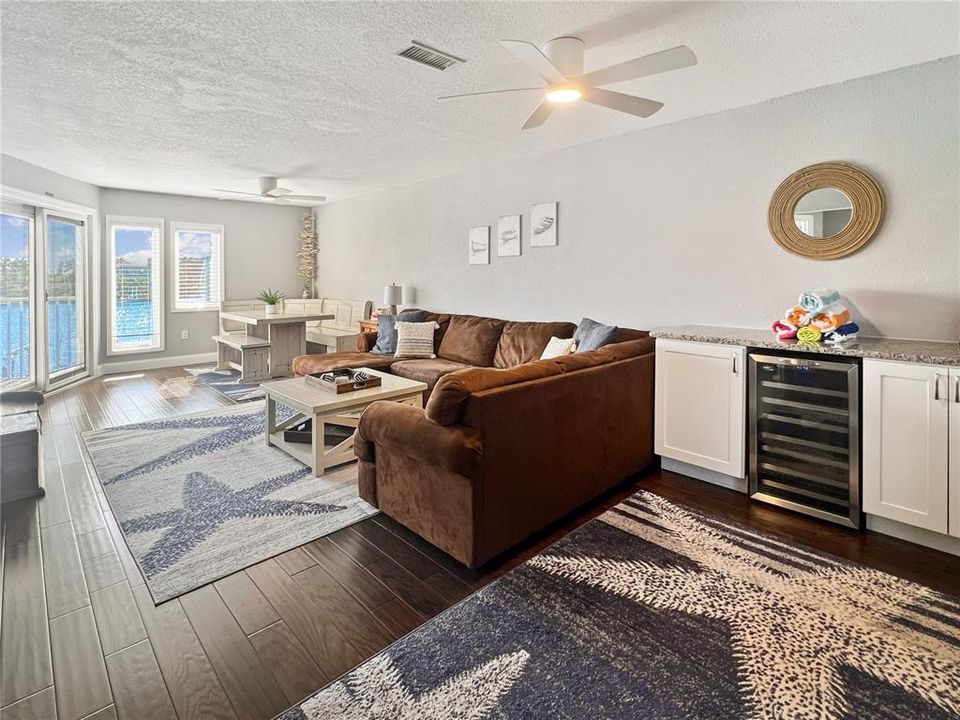 Living room with granite countertop and beverage fridge