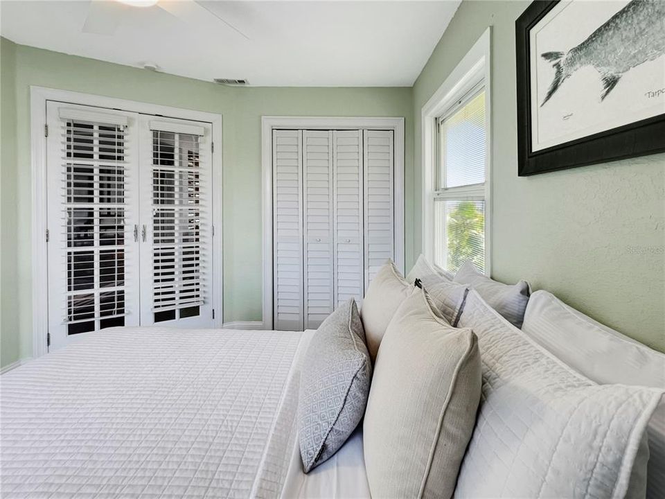 Main floor bedroom with balcony access