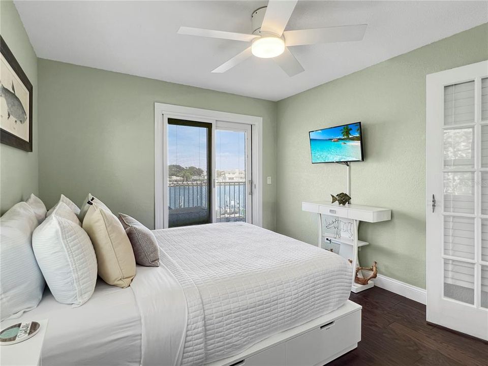 Main floor bedroom with balcony access