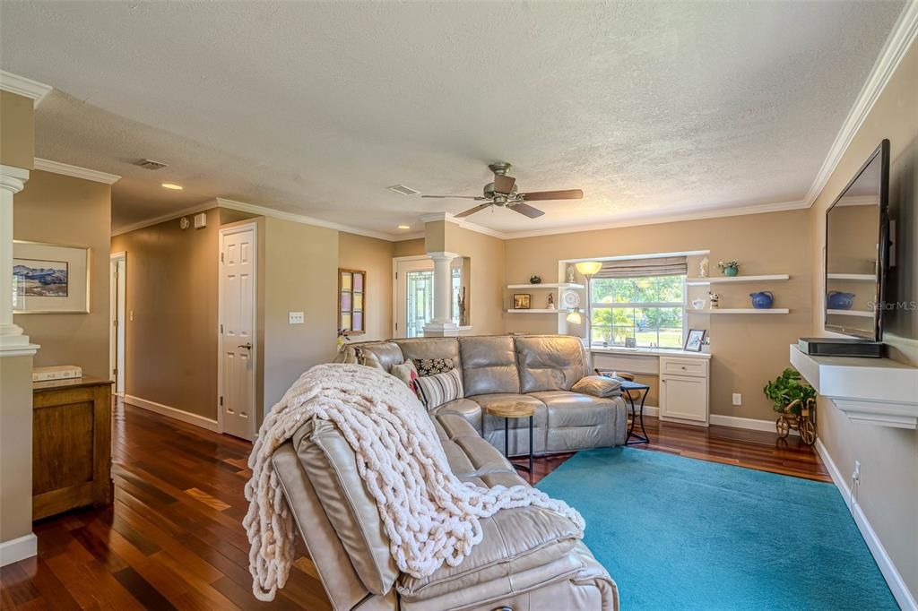 Living Room with built in desk overlooking the front yard.