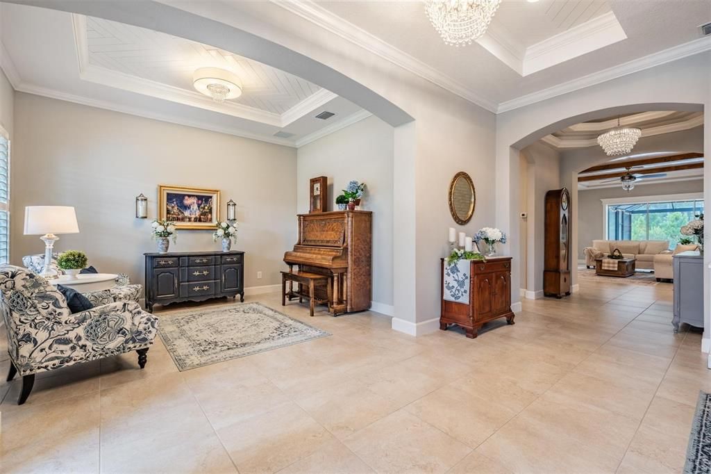 Office/flex room being used as a living room, to the left of the foyer/front door