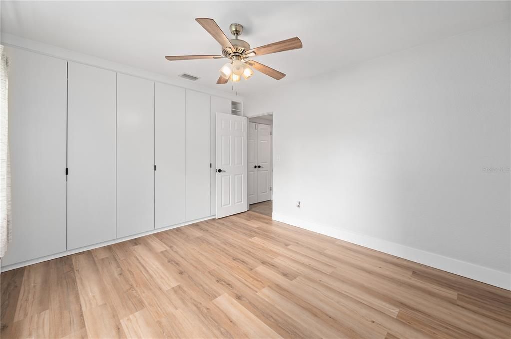 Bedroom 3 with custom built in wall to wall closets