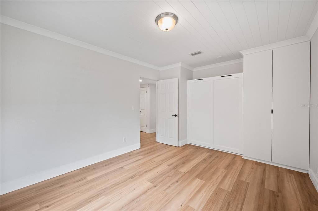 Bedroom 2. Custom built in murphy bed with custom built in closet storage.