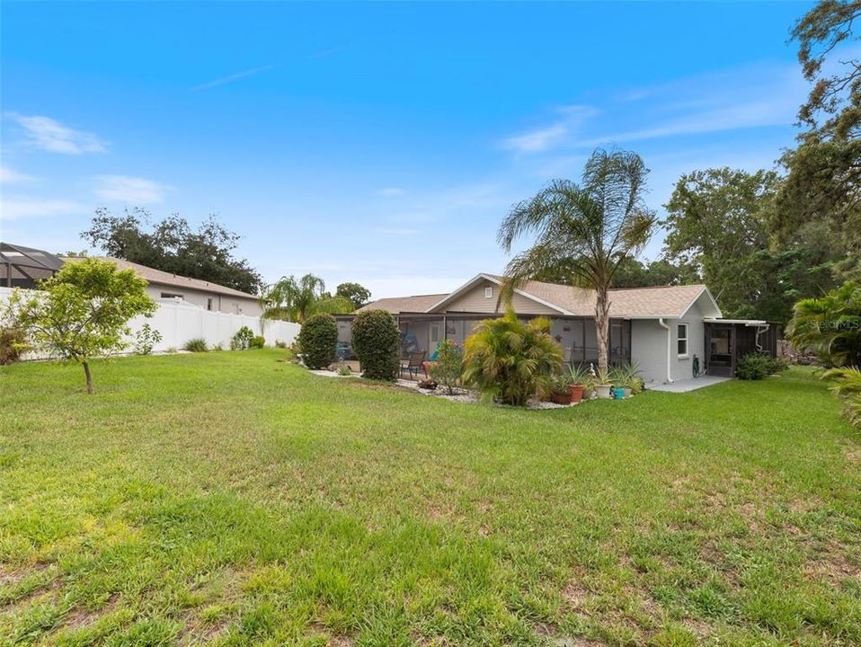 Enjoy the expansive back yard with fruit trees and garden space