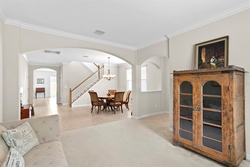 Graceful arches from the foyer into the living and dining rooms