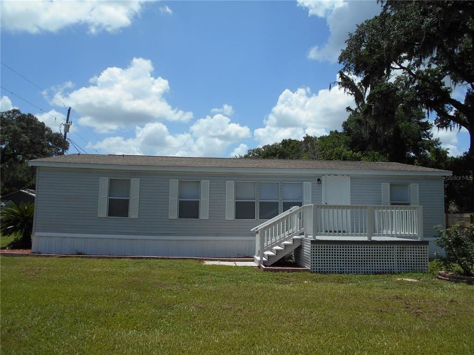 Front view features deck with ample room for outdoor furniture.