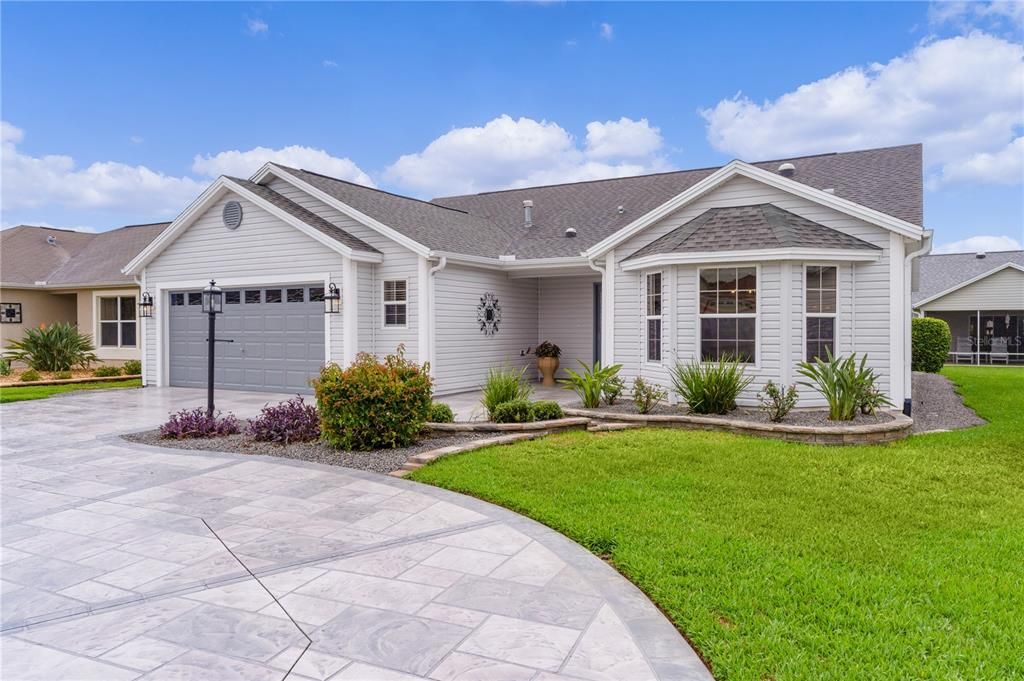 Gorgeous stamped & painted concrete circular driveway & walkway