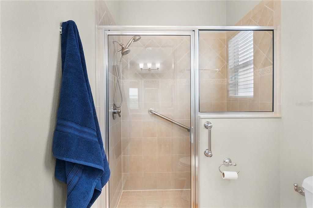 Pocket door to private toliet & shower area