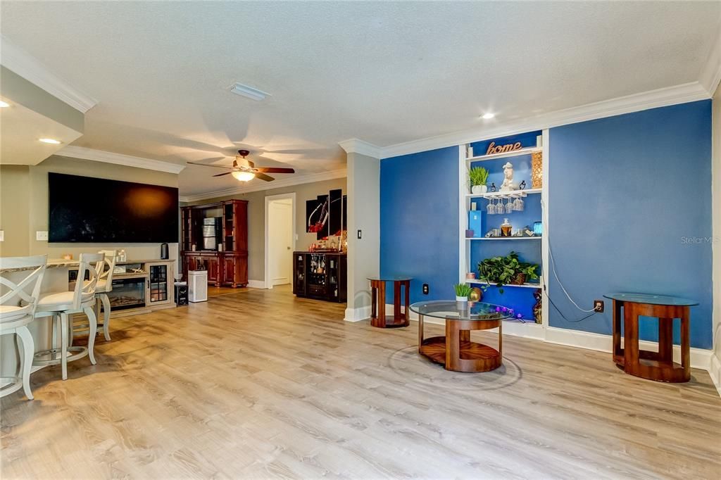 Beautiful Built In Bookshelf with Crown Molding Throughout Living Space Provides an Upper Level Aesthetic!