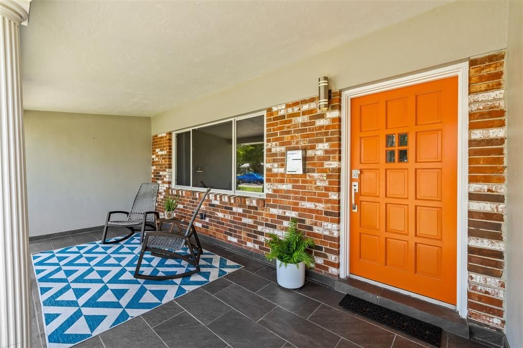 Huge Covered Front Porch is Perfect for Rainy Days and Greeting Guests