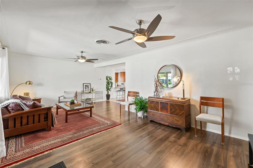 Living Room Opens to Dining and Kitchen