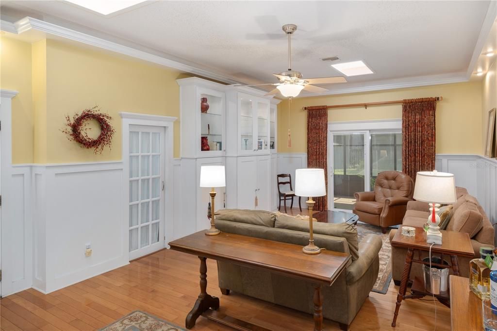 Large built-in and slider leading to the enclosed back porch.