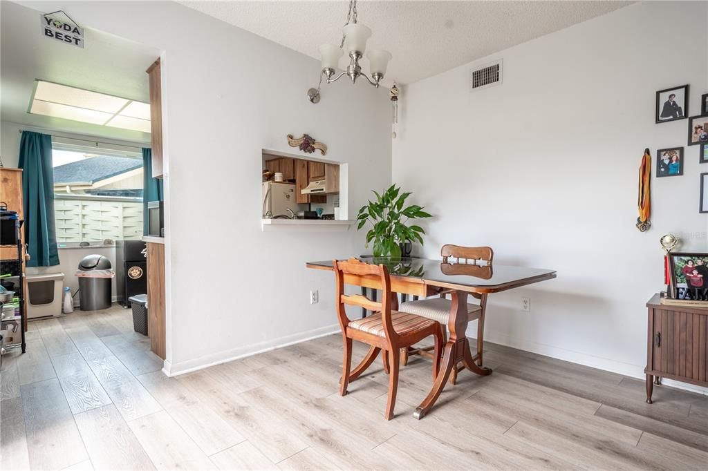 The dining room is open to the kitchen and has a pass through.