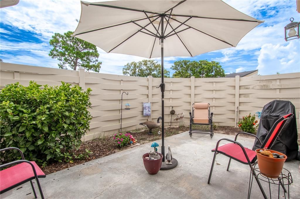 The vinyl fence (maintained by the HOA) assures privacy on your patio while dining al fresco or just relaxing with a good book.