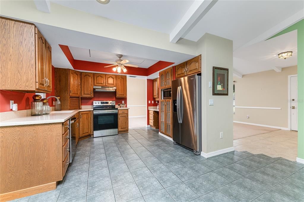 Kitchen with wood cabinets, solid surface counters