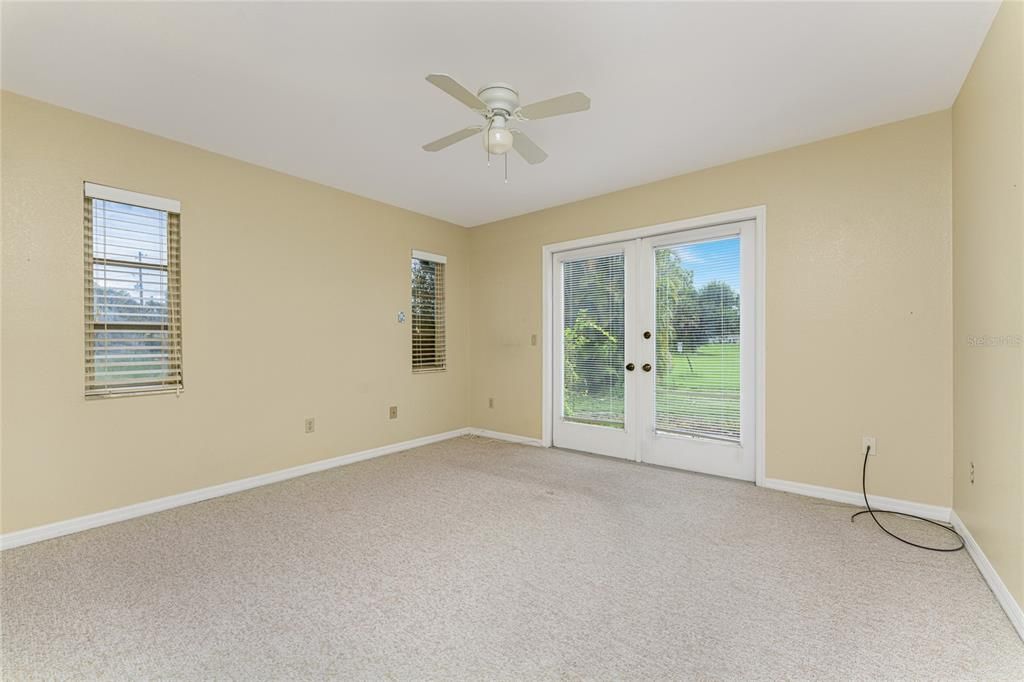 Guest bedroom 2 with French doors to the outdoors