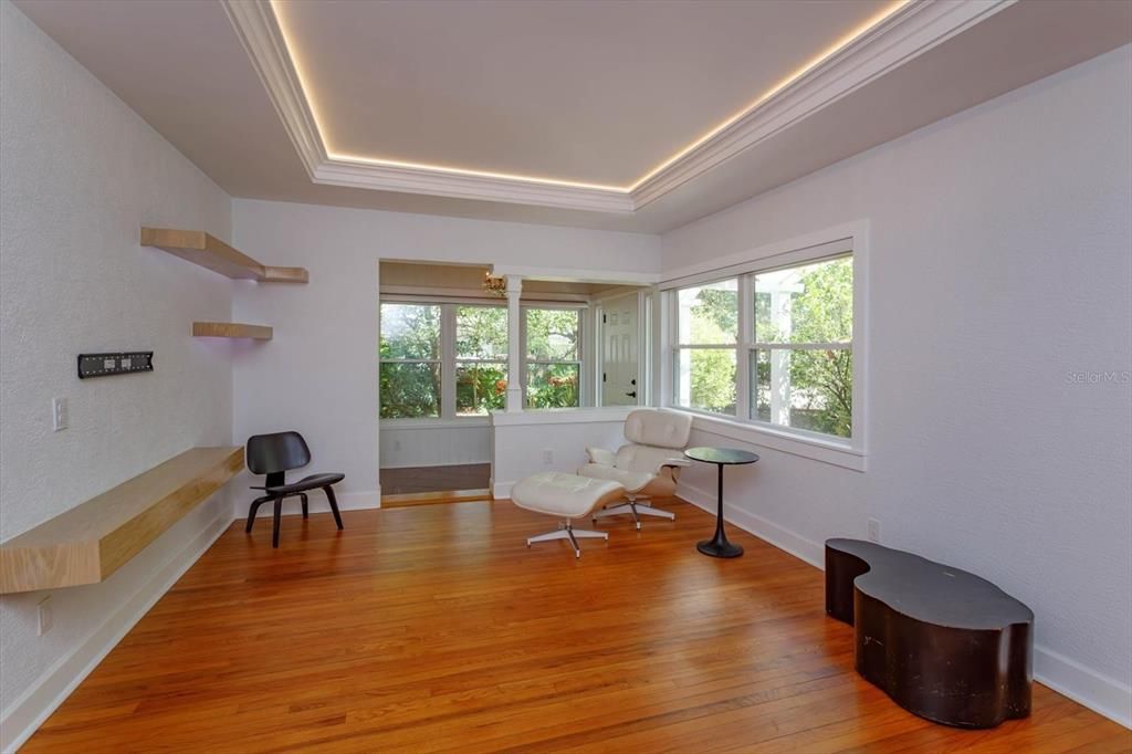 Living Room with Custom Lighting and Floating Shelves