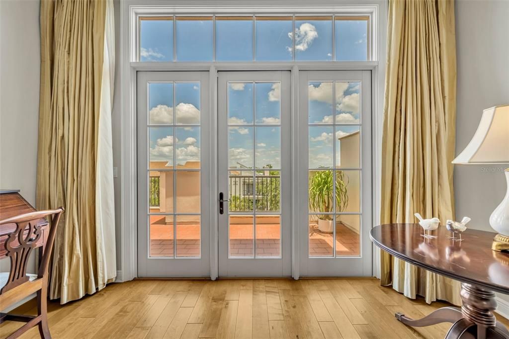 French door from Primary Suite leads to large, private balcony