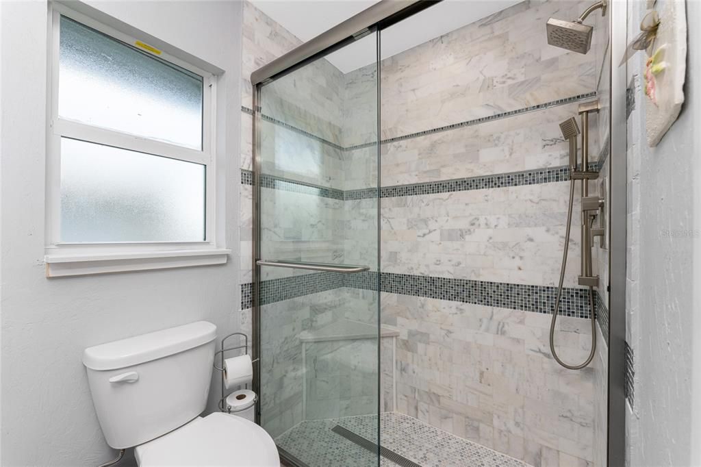 Beautifully remodeled tiled walk-in shower