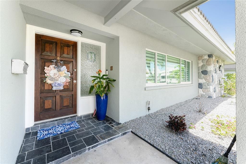 Welcoming slate front porch and original solid wood front door