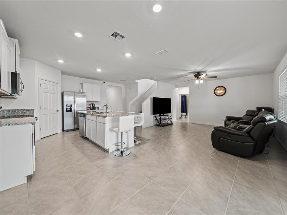 From the sliding glass, view of the kitchen/dining/living room combo. Gorgeous open concept