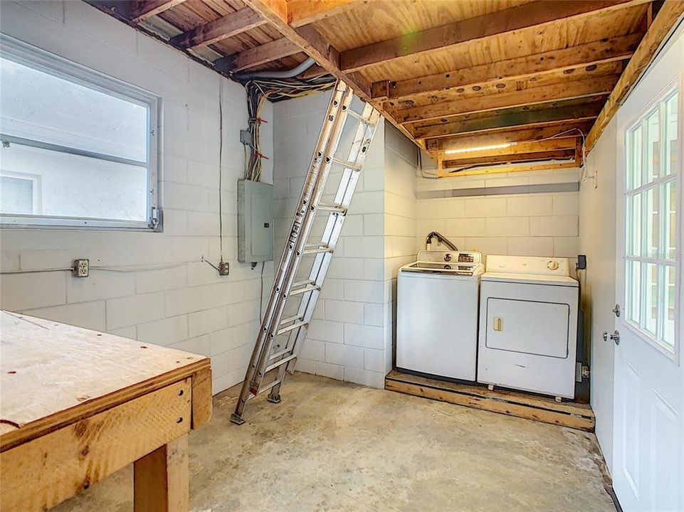 Utility/laundry room and workshop - plenty of storage here! (ladder does not convey)