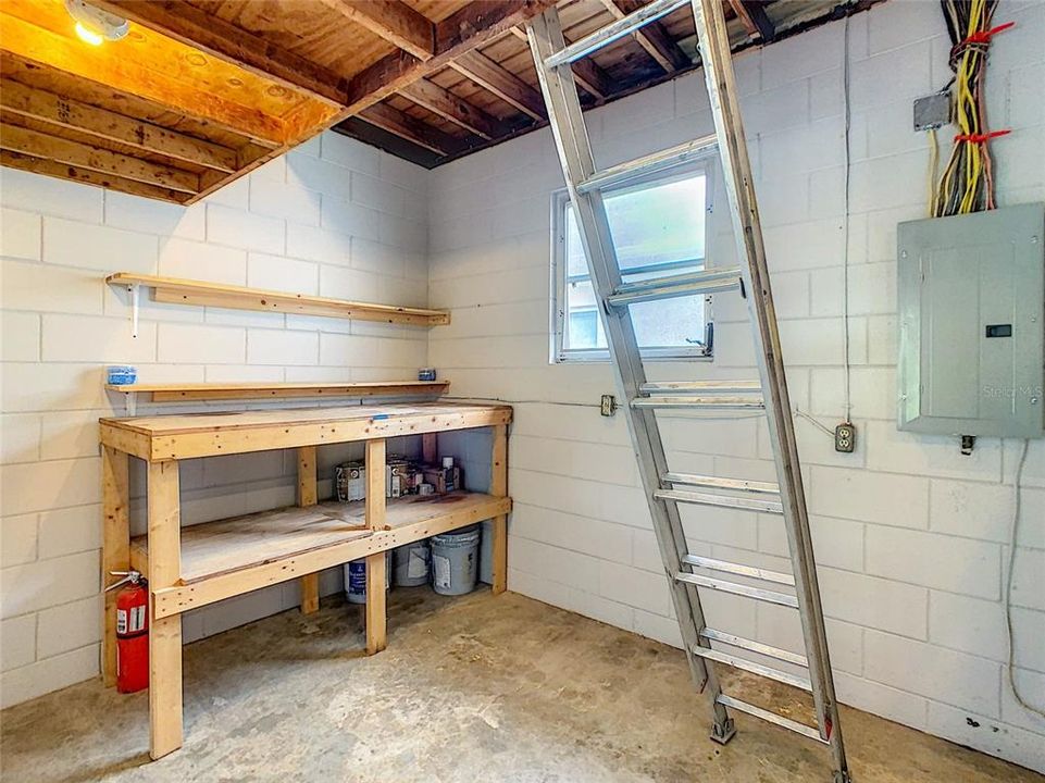 Utility/laundry room and workshop (ladder does not convey)