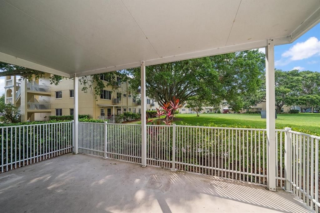 Covered patio overlooks garden area allowing you to enjoy the outdoors from your unit