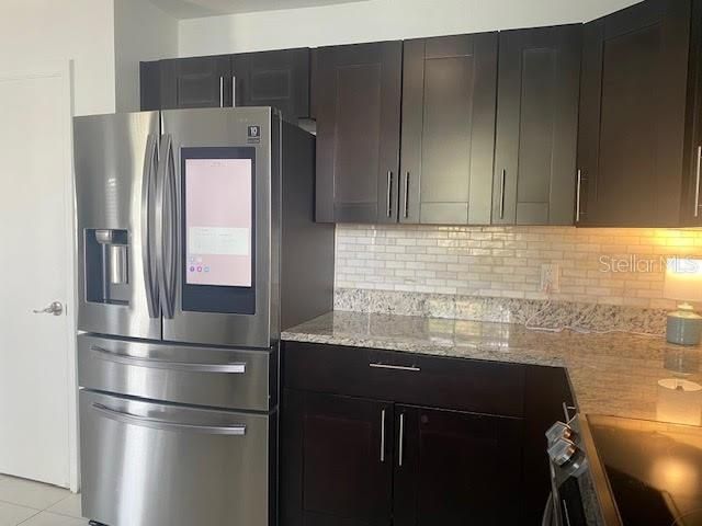 Kitchen with Samsung smart stainless appliances