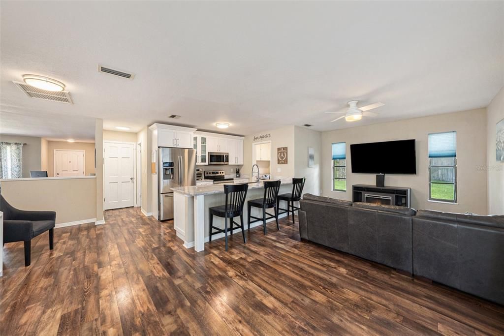 The beautifully updated kitchen opens to the family room