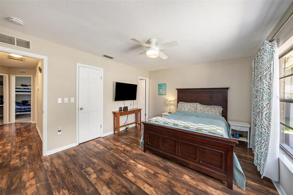 Large primary bedroom features 3 closets!