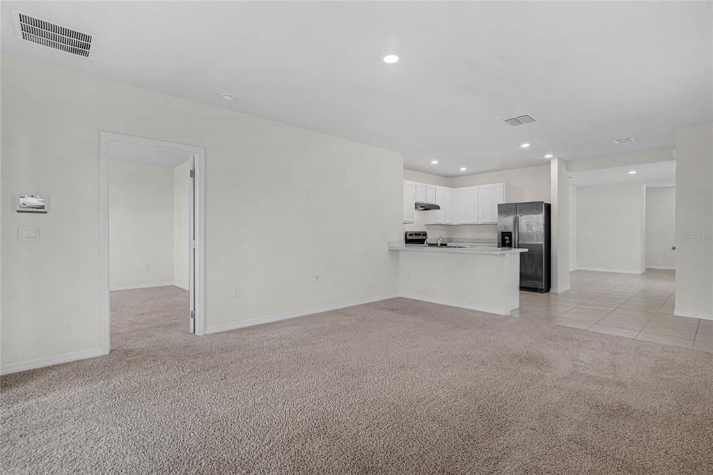 Living Room with view of White Kitchen