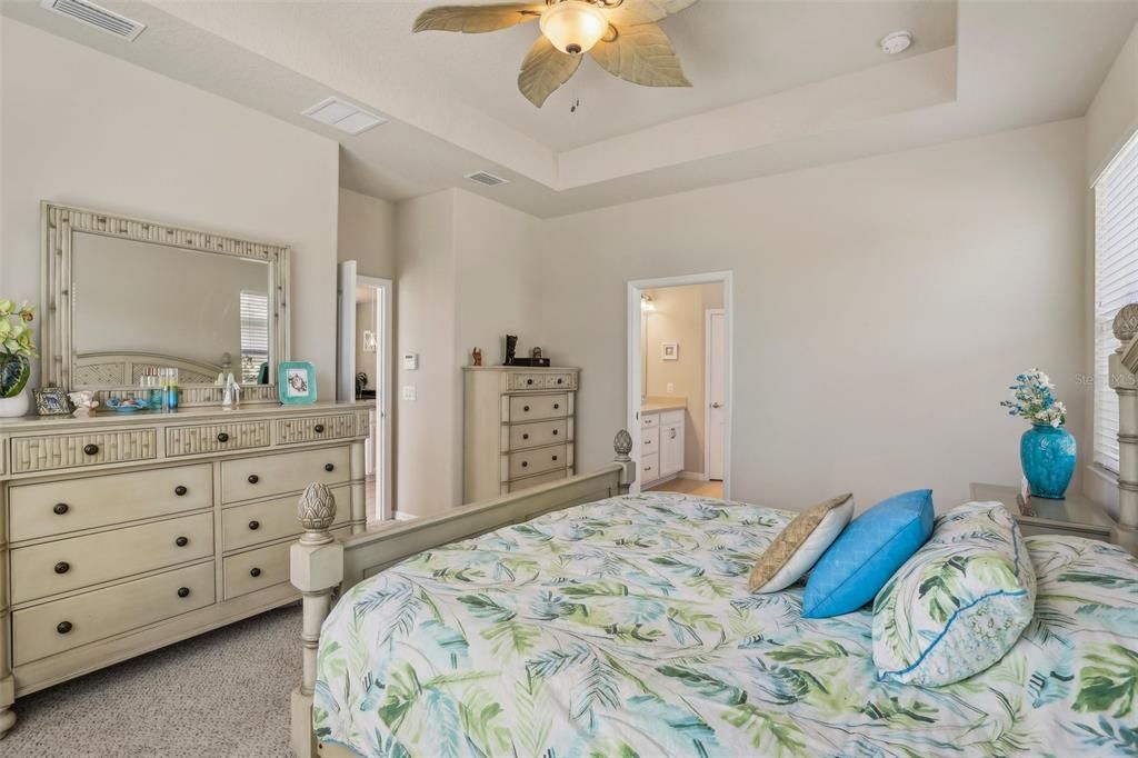 Primary Bedroom overlooking pool and backyard