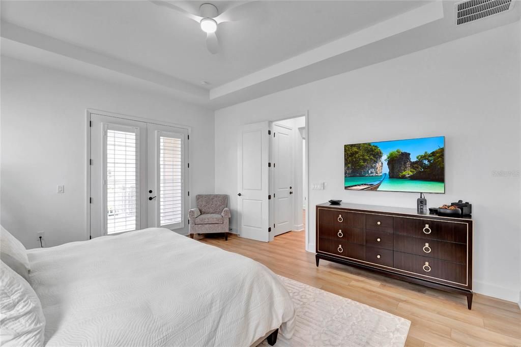 Master bedroom, with French doors to front porch.