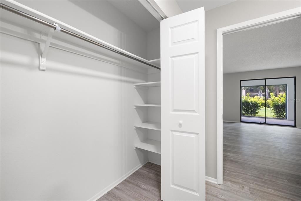 Primary bedroom second closet and shelving