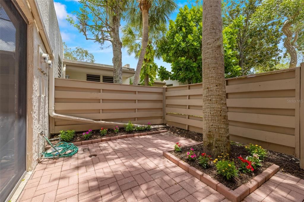 Private patio in front of property