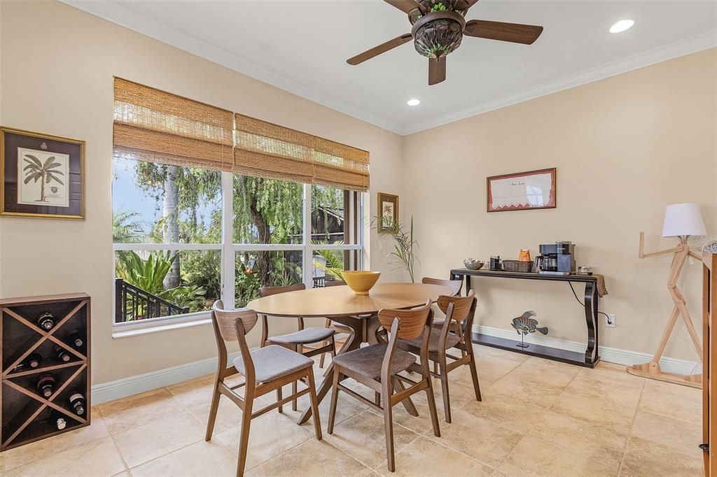 Dining room overlooks the tropical backyard