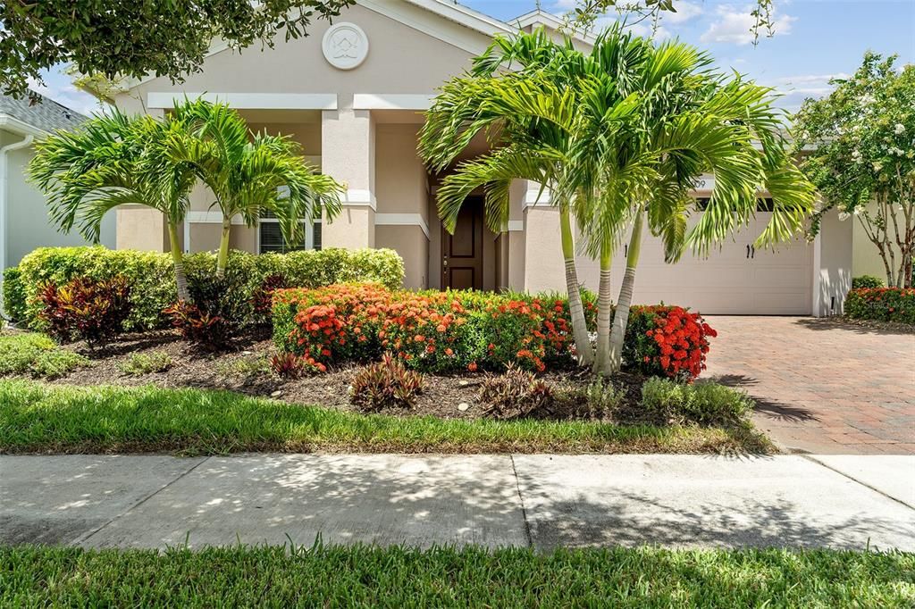 Lush landscaping and and paver drive/walkway