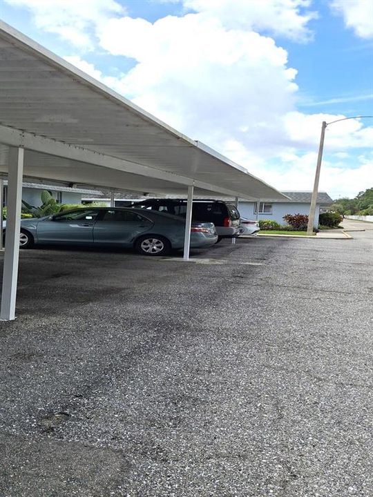 Carport with unit / building at the end