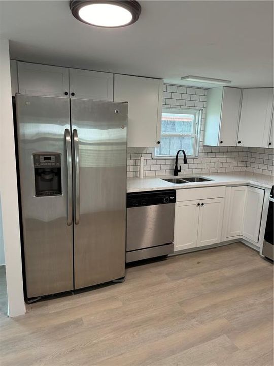 All Stainless appliances stainless sink and kitchen