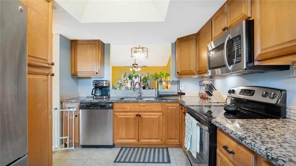 Kitchen with updated cabinets, granite counters and stainless steel appliances