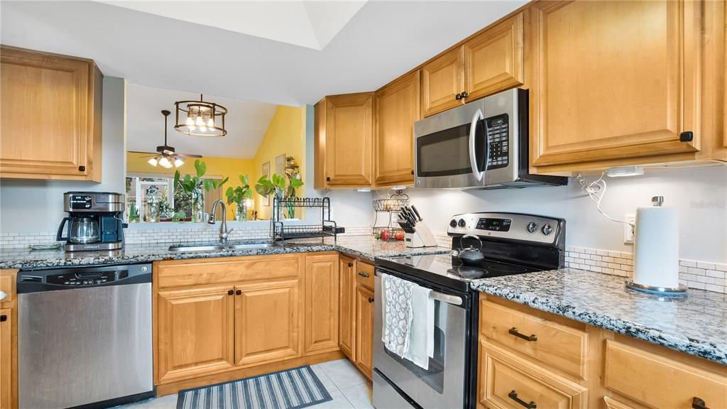 Kitchen with updated cabinets, granite counters and stainless steel appliances