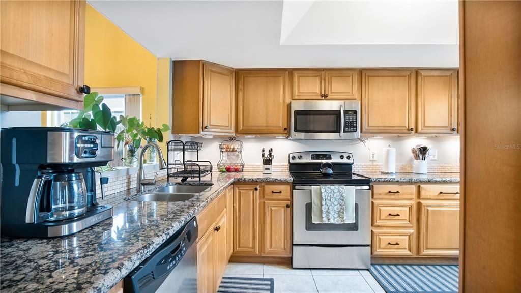 Kitchen with updated cabinets, granite counters and stainless steel appliances