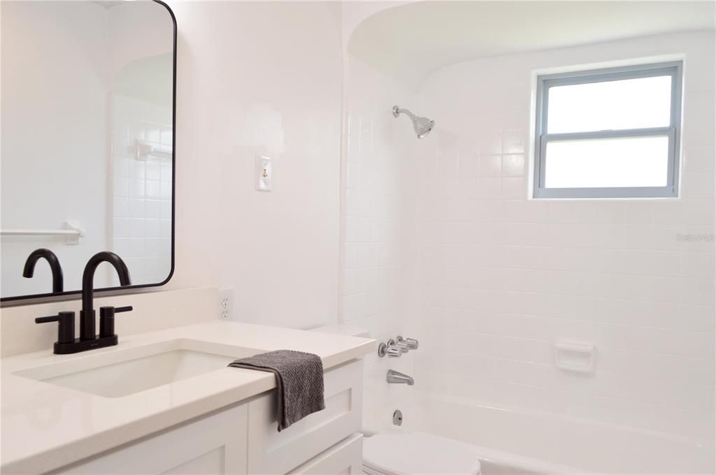 Bathroom 2  Corian Countertops and tub