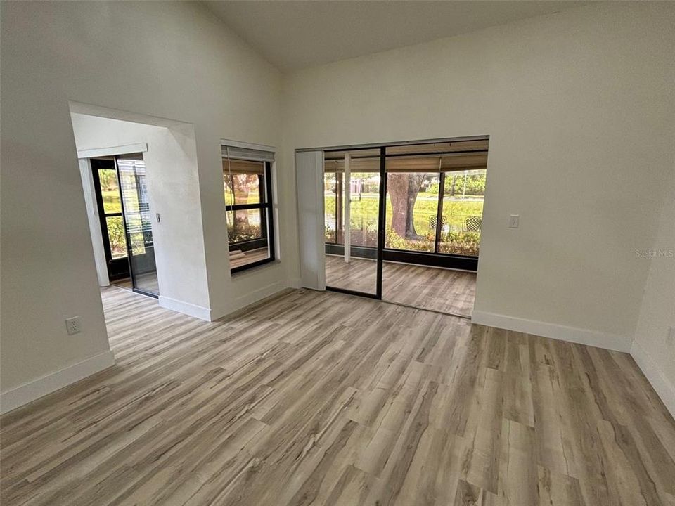 Living room w/ kitchen entryway to the left