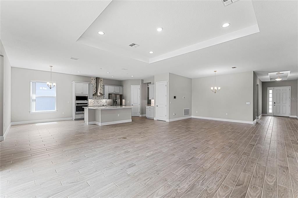 View of the Great Room,Kitchen nook, Kitchen, and the Dining area.