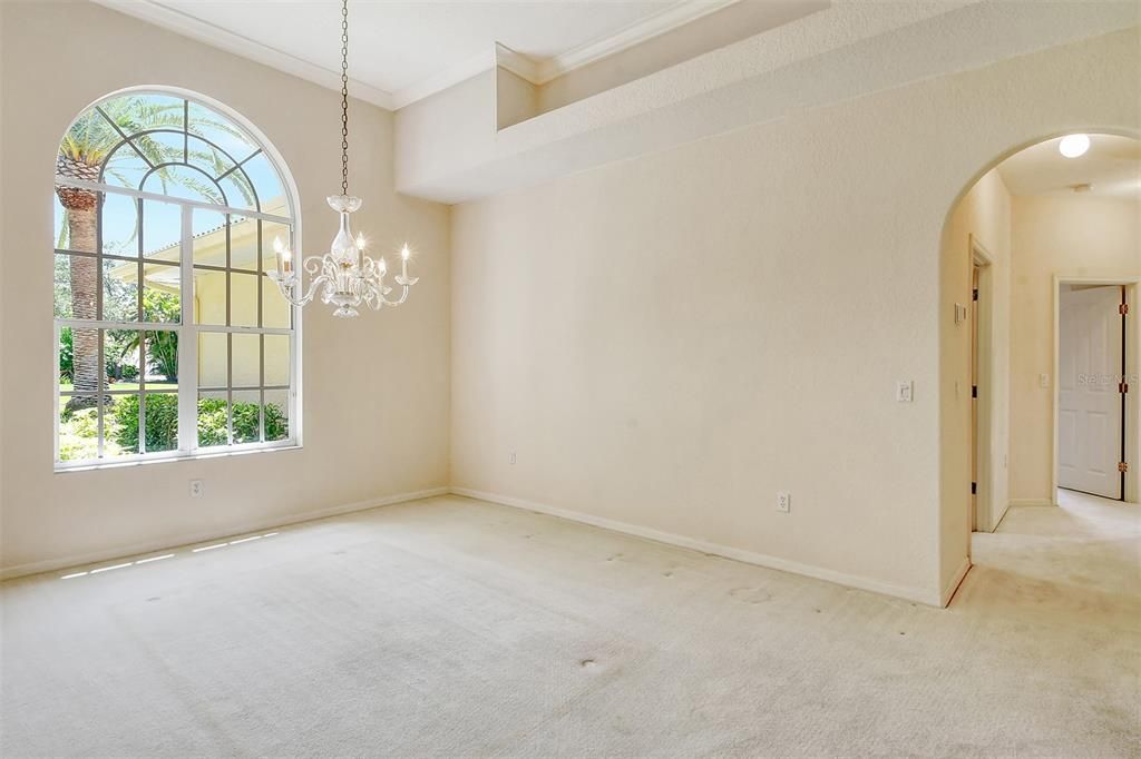 The dining room is between the kitchen and living room