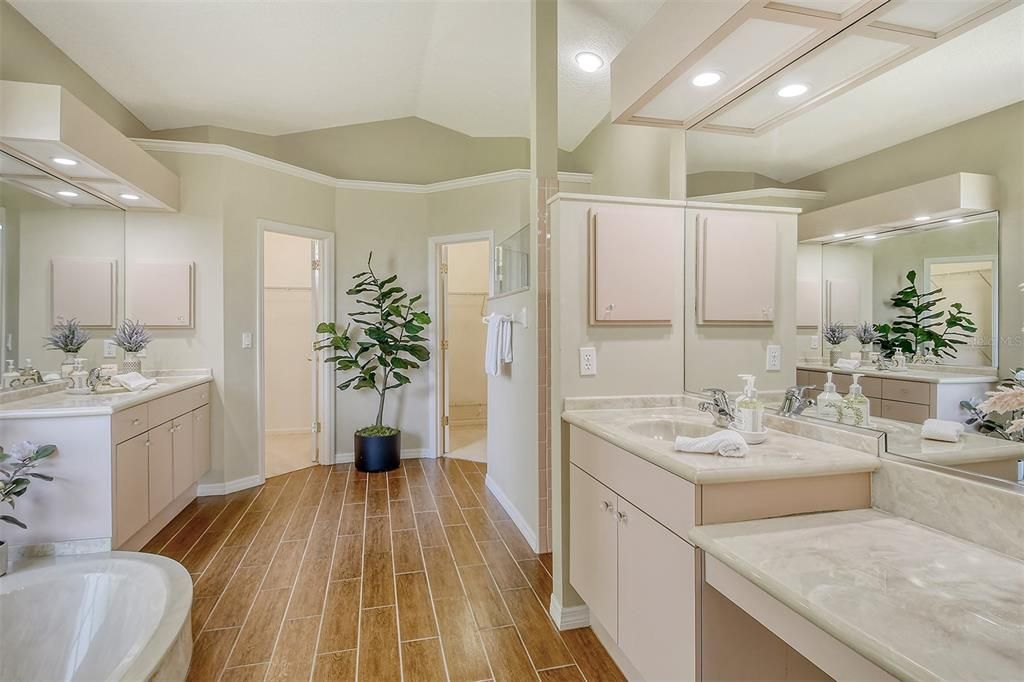 Dual sinks, private shower and garden tub, dual walk-in closets